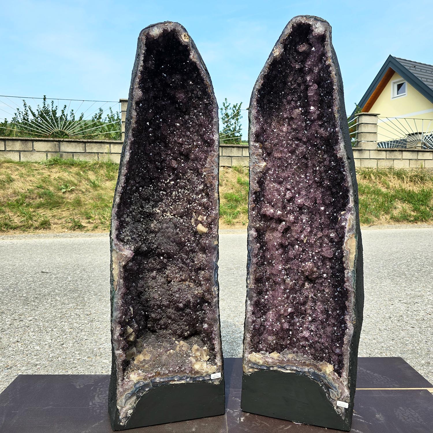 Unique pair of Amethyst geodes on display, promoting harmony, transformation, and relaxation, ideal for meditation and energy cleansing.