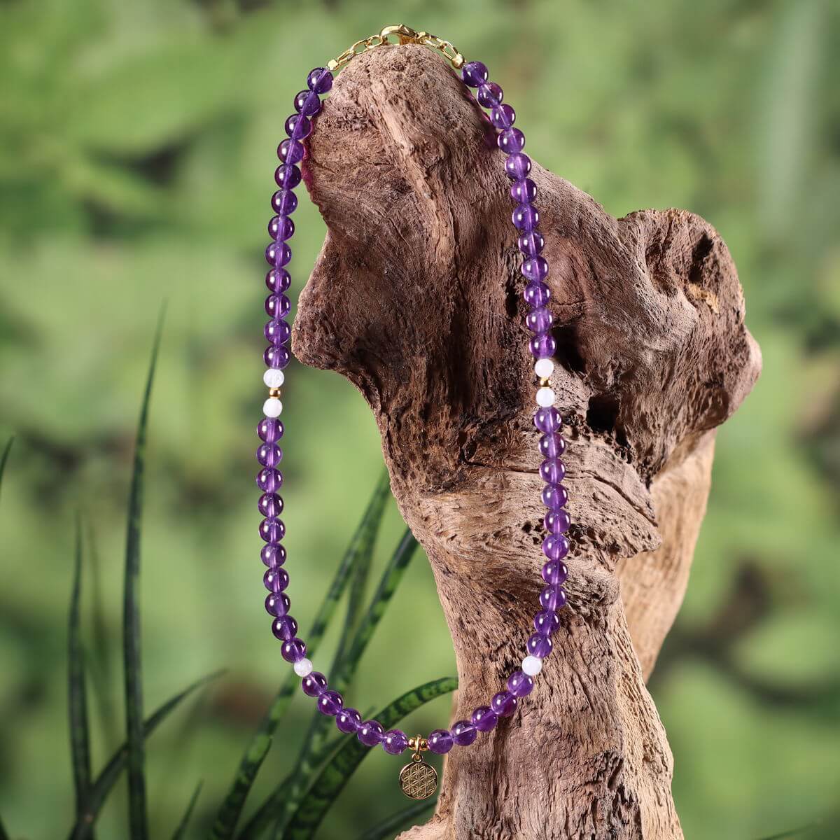 Amethyst and white labradorite necklace with Flower of Life pendant on a wooden stand, 41cm, symbolizes spirituality and femininity.
