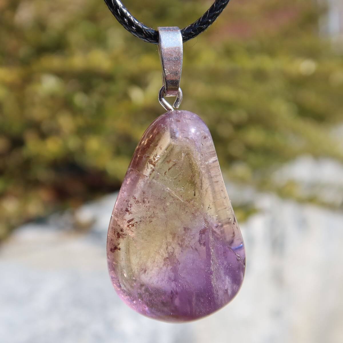 35mm Ametrine pendant with silver bail showcasing unique violet-golden hues, symbolizing harmony and creativity. Unique piece No. 10.
