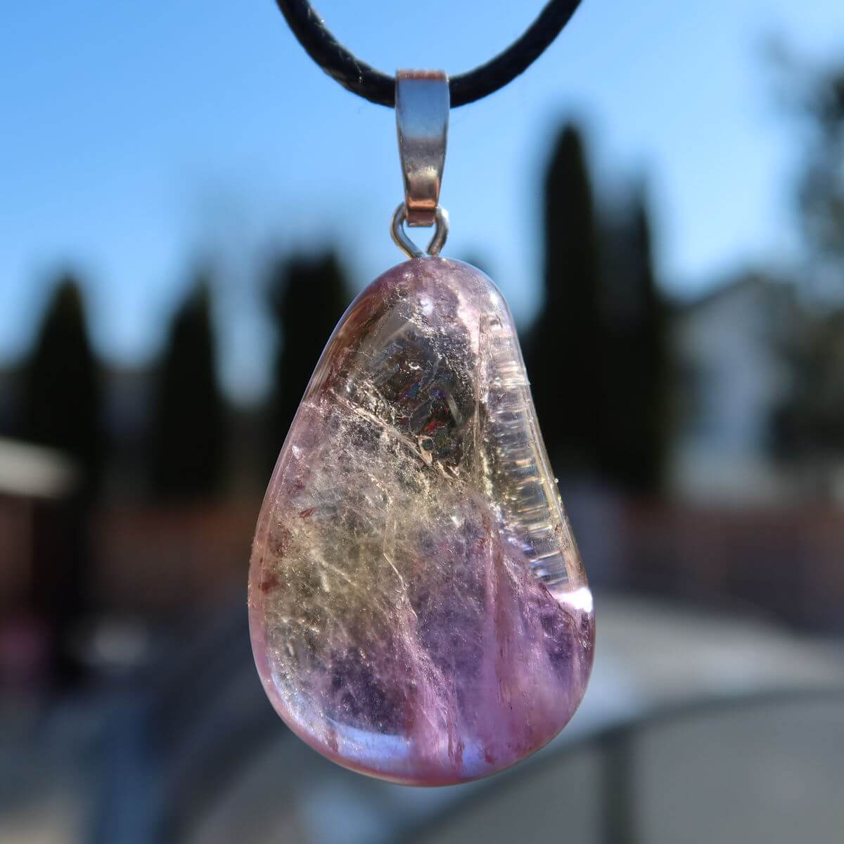 35mm Ametrine pendant with silver bail showcasing unique violet-golden hues, symbolizing harmony and creativity. Unique piece No. 10.