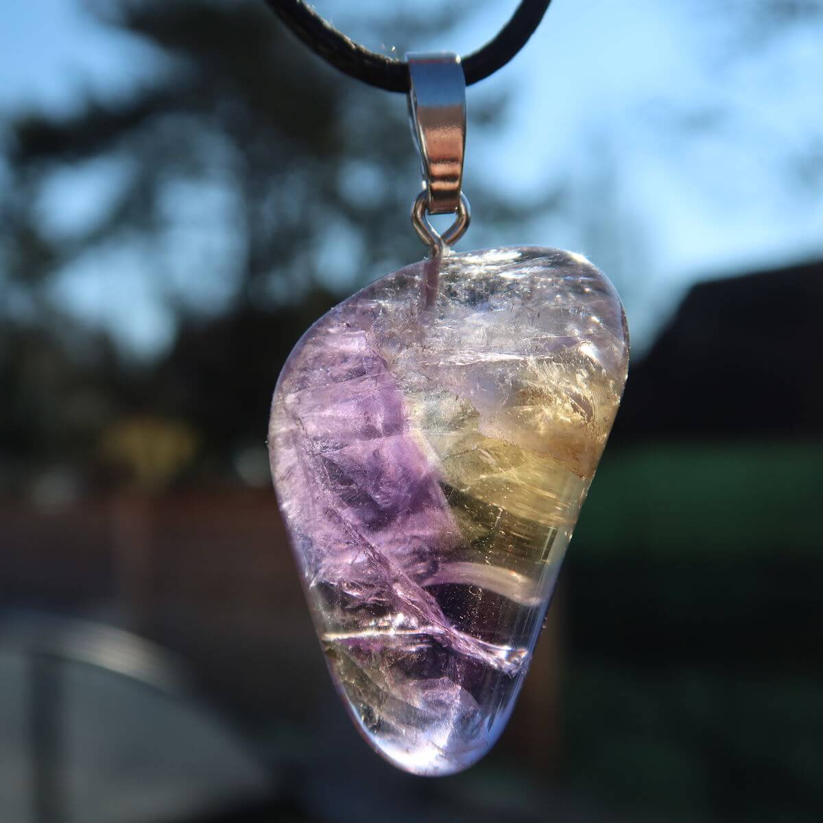 Ametrin pendant with silver loop featuring violet-golden hues, 35mm, promoting harmony and creativity, unique piece number 2.