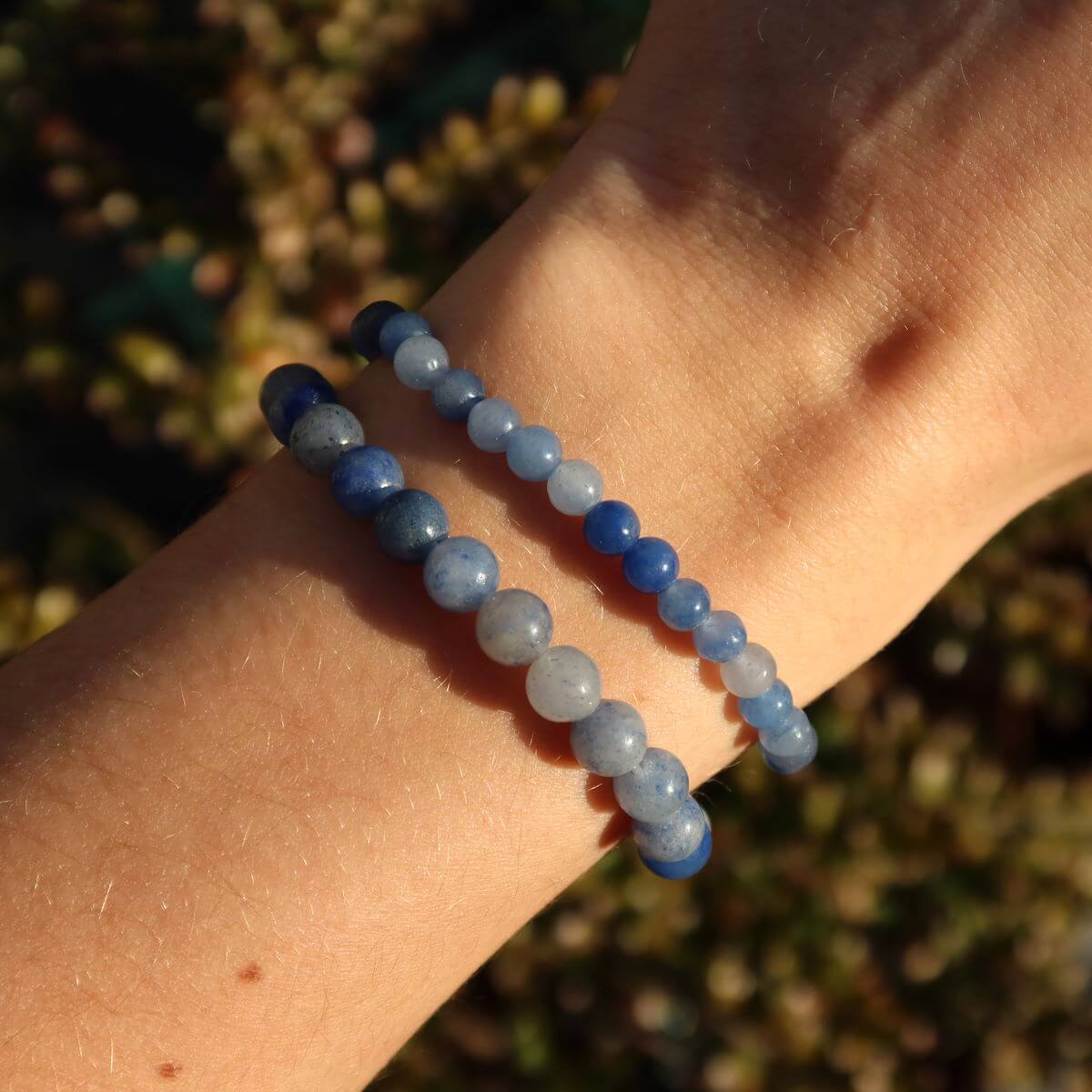 Blue quartz gemstone bracelet for thin wrists, shown in varying bead sizes, 4mm, 6mm, and 8mm, offering a stylish, calming accessory.