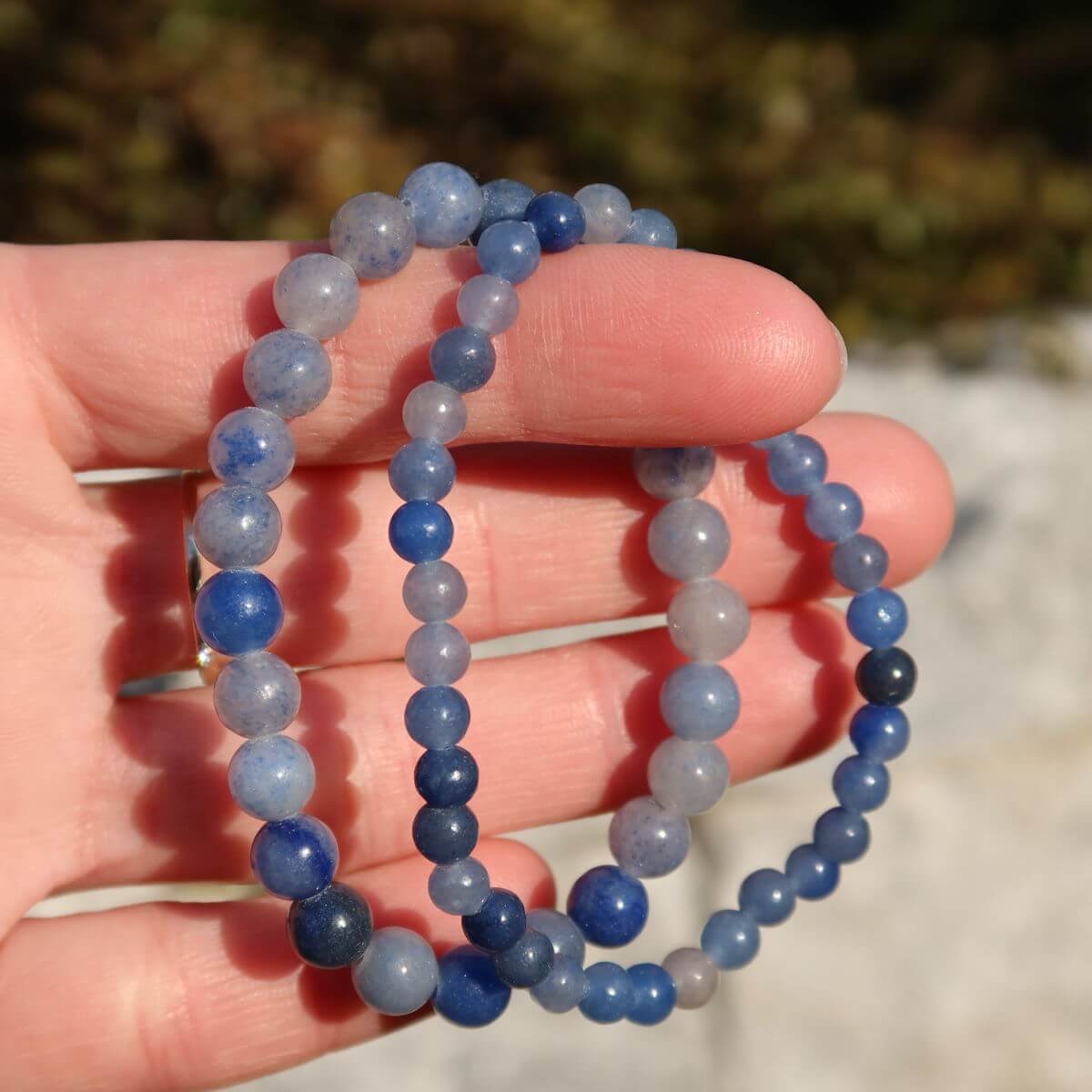 Blue quartz gemstone bracelet for thin wrists, shown in varying bead sizes, 4mm, 6mm, and 8mm, offering a stylish, calming accessory.