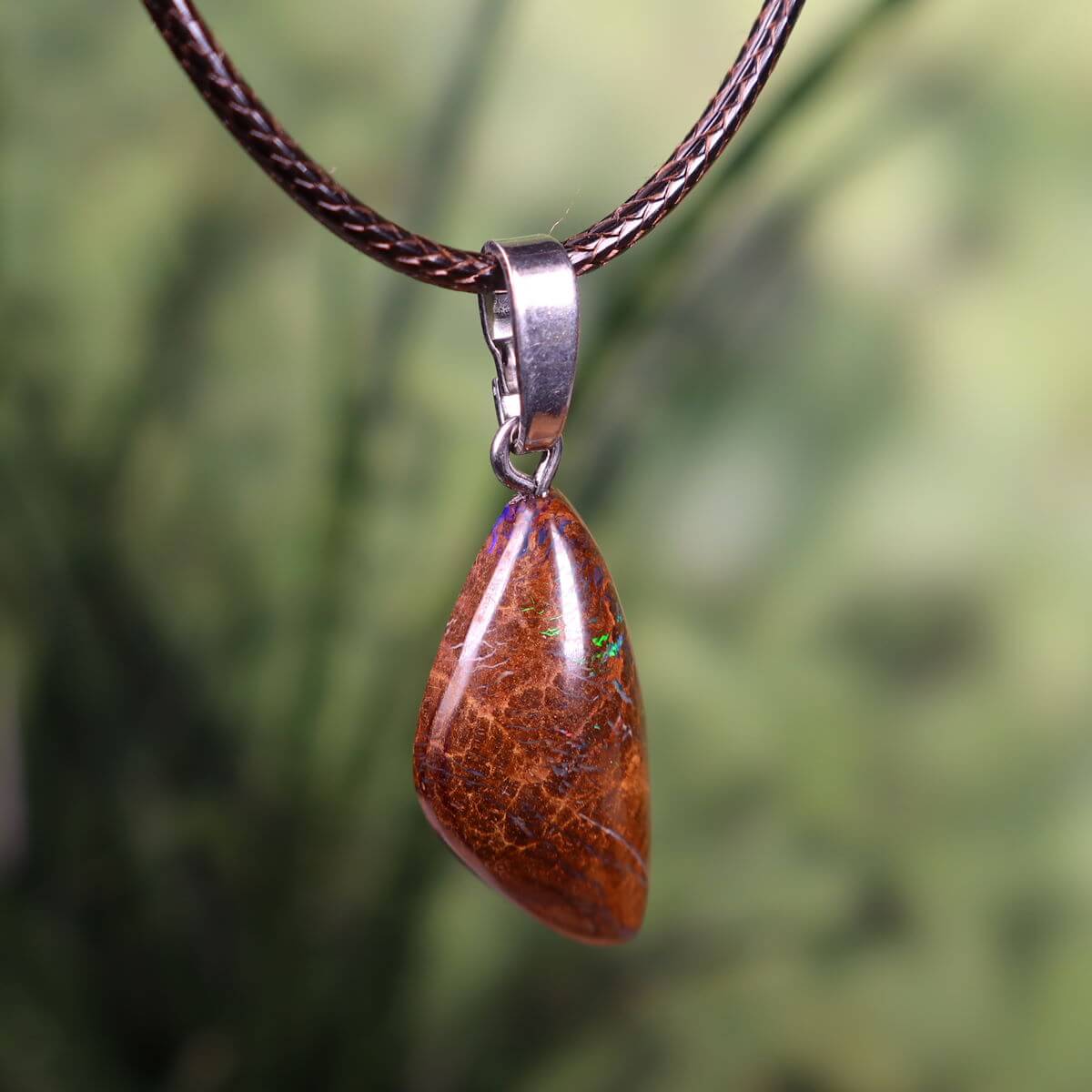 Handcrafted Boulder Opal Pendant with Silver Bail, 28x15mm, Unique Design, Reflecting Natural Beauty and Elegance.