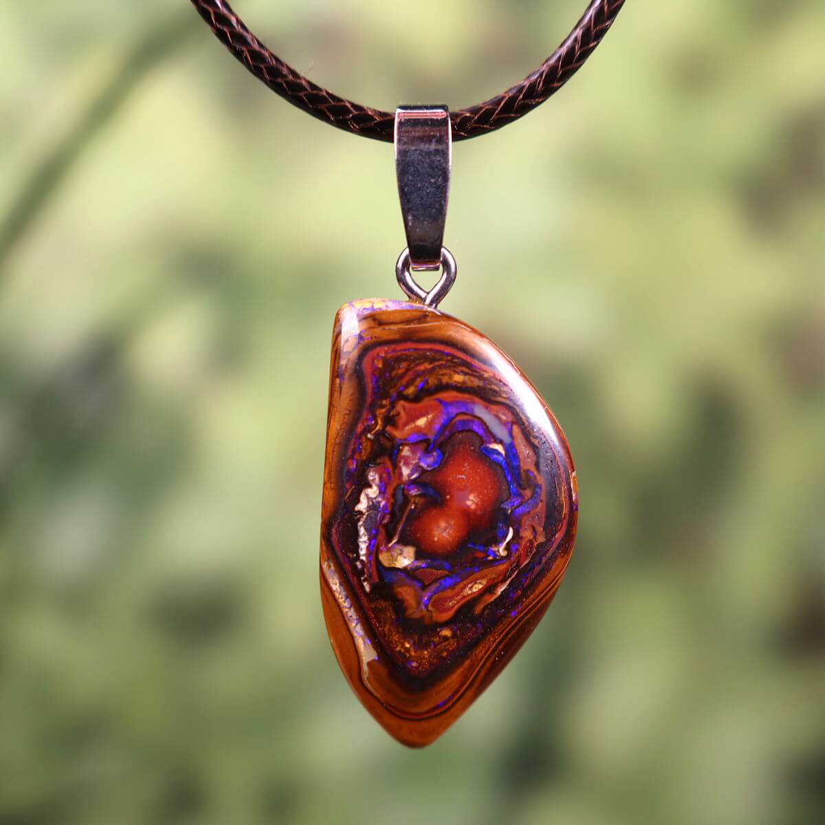 Boulder Opal pendant with massive silver loop, hand-polished unique gemstone, size 30x18mm, Australian origin, nature-inspired design.