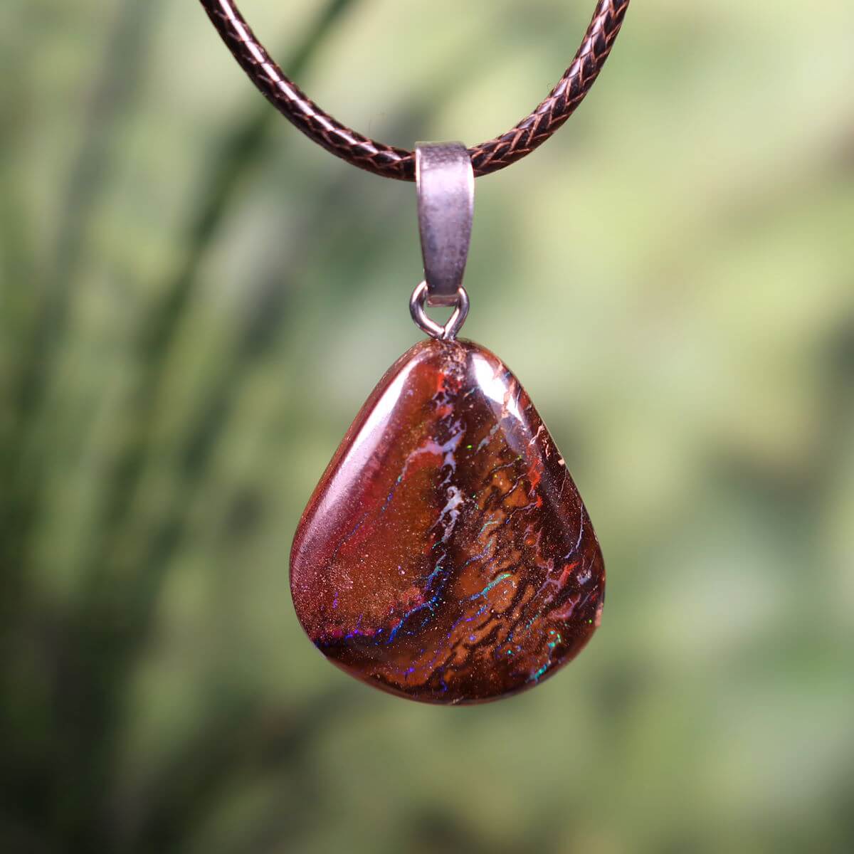 Handcrafted Boulder Opal Pendant with Silver Loop, 27x20mm, featuring unique natural patterns. Elegant Australian gemstone jewelry.