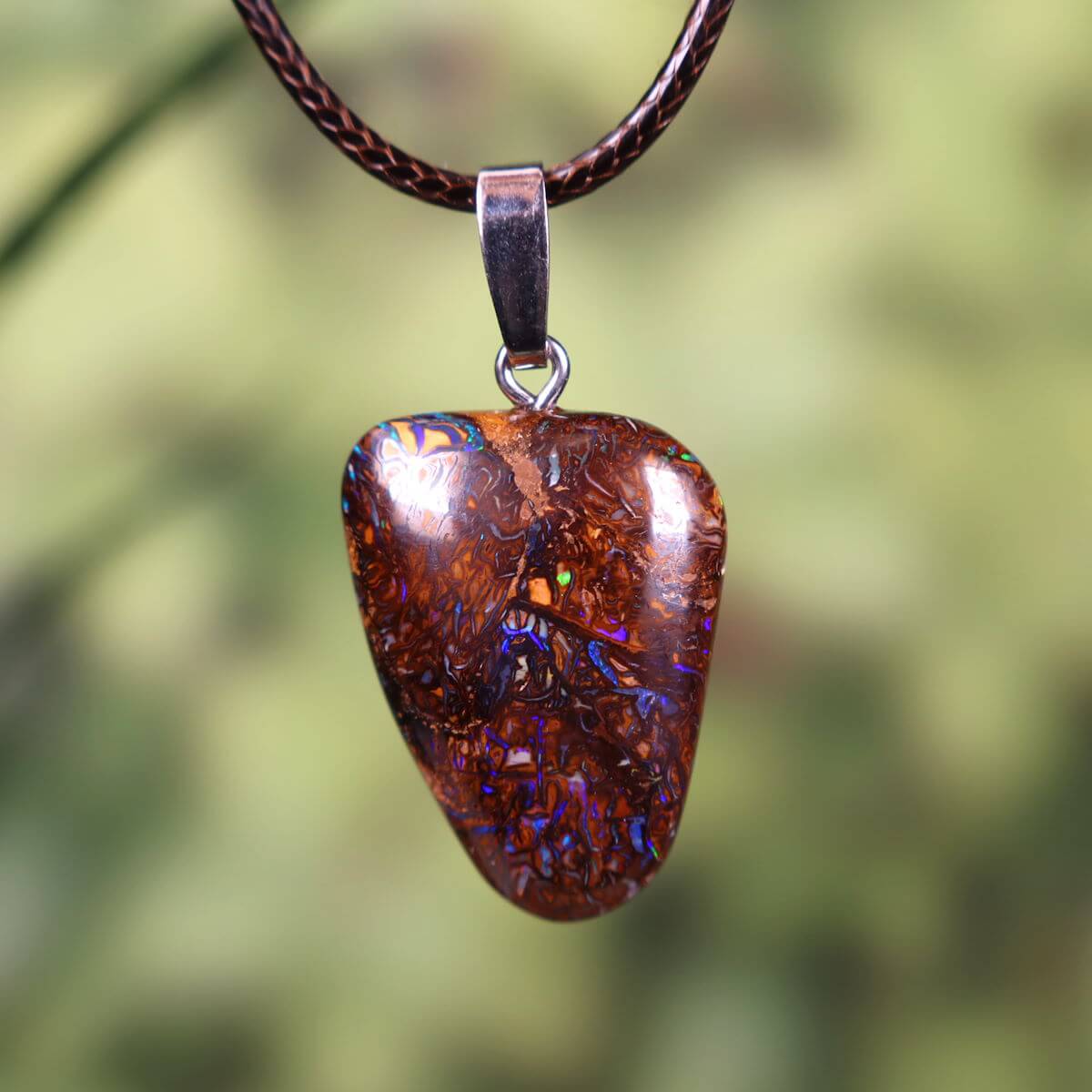 Boulder Opal pendant with massive silver loop, hand-polished, 28x20mm, unique Australian gemstone, nature-inspired jewelry.