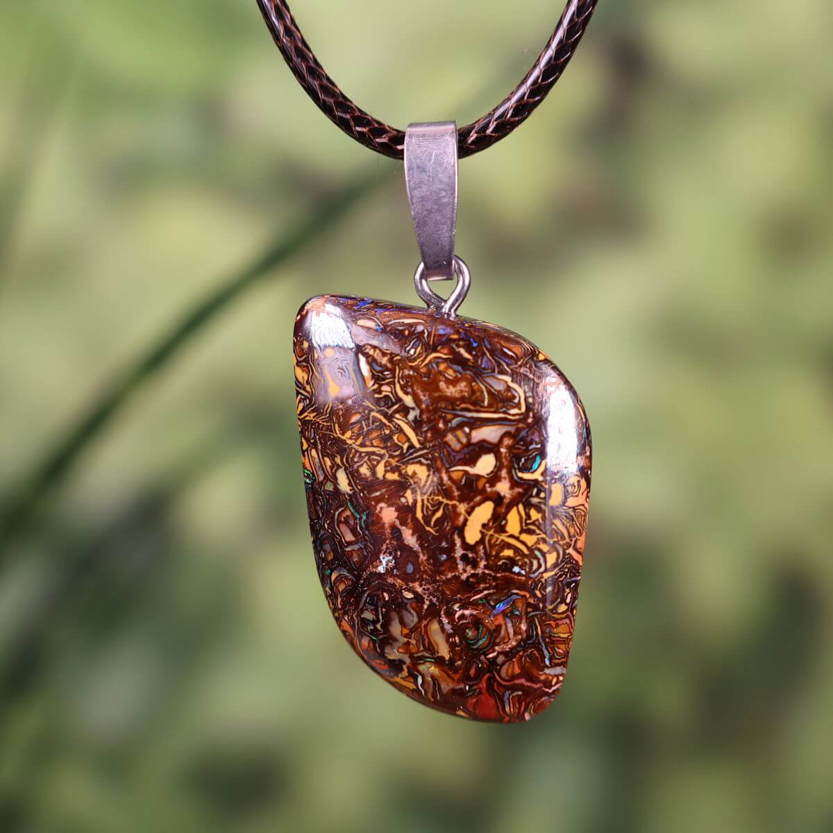 Boulder Opal pendant with rhodium-plated silver loop, unique design hand-polished in Australia, 30x20mm, nature-inspired jewelry.