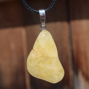 Yellow Danburite pendant with leather cord, showcasing clear structure and unique color nuances, offering fresh energy.