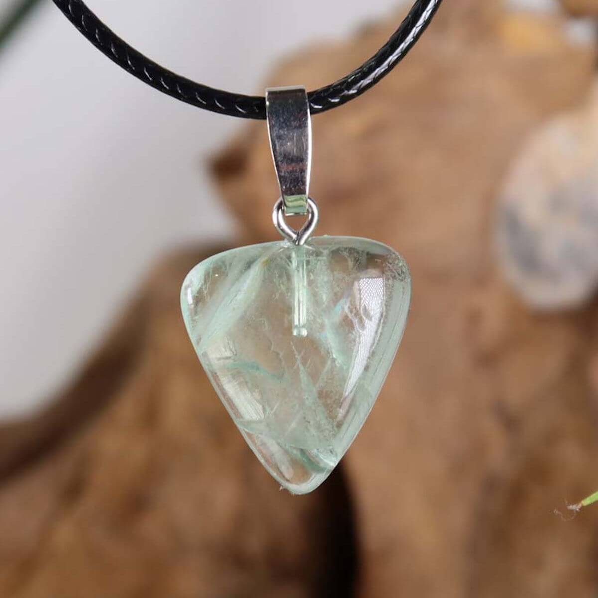 Fluorite pendant with green hues, unique design, featuring a silver rhodium-coated bail, symbolizing focus and new beginnings.