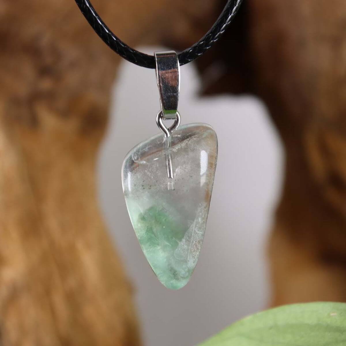 Fluorite pendant with silver rhodium-plated bail, showcasing unique green and violet hues for concentration and clarity.