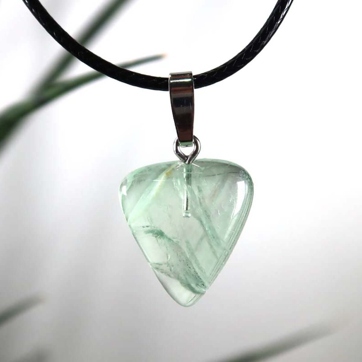 Fluorite pendant with green hues, unique design, featuring a silver rhodium-coated bail, symbolizing focus and new beginnings.