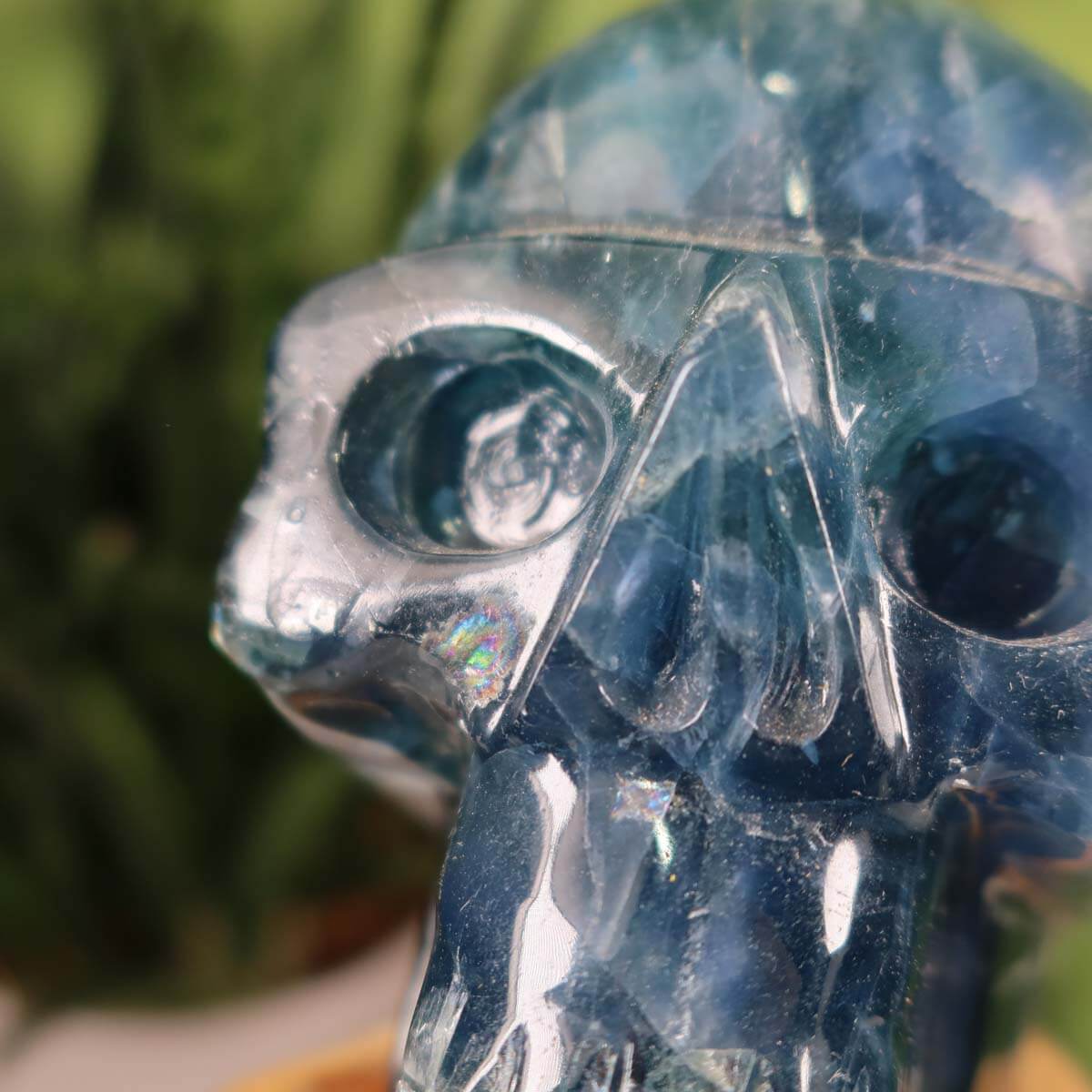 Handmade large fluorite crystal skull on display, unique gemstone art piece for collectors, 13x10 cm.
