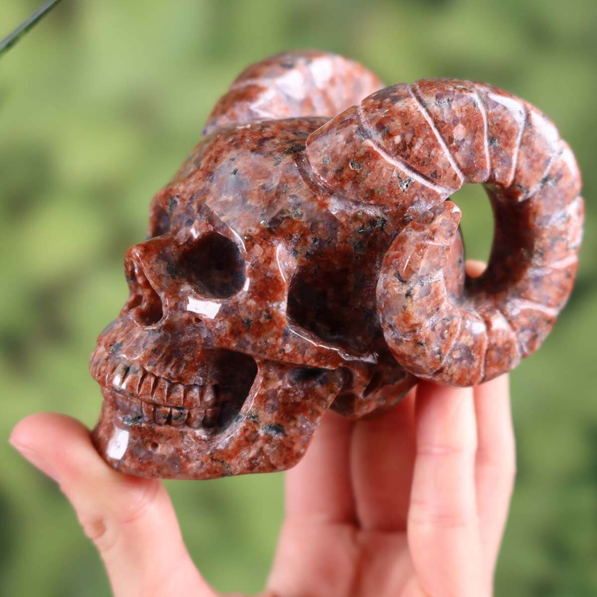 Handcrafted granite crystal skull with unique shape and horns, collector's item from Steinwelten.