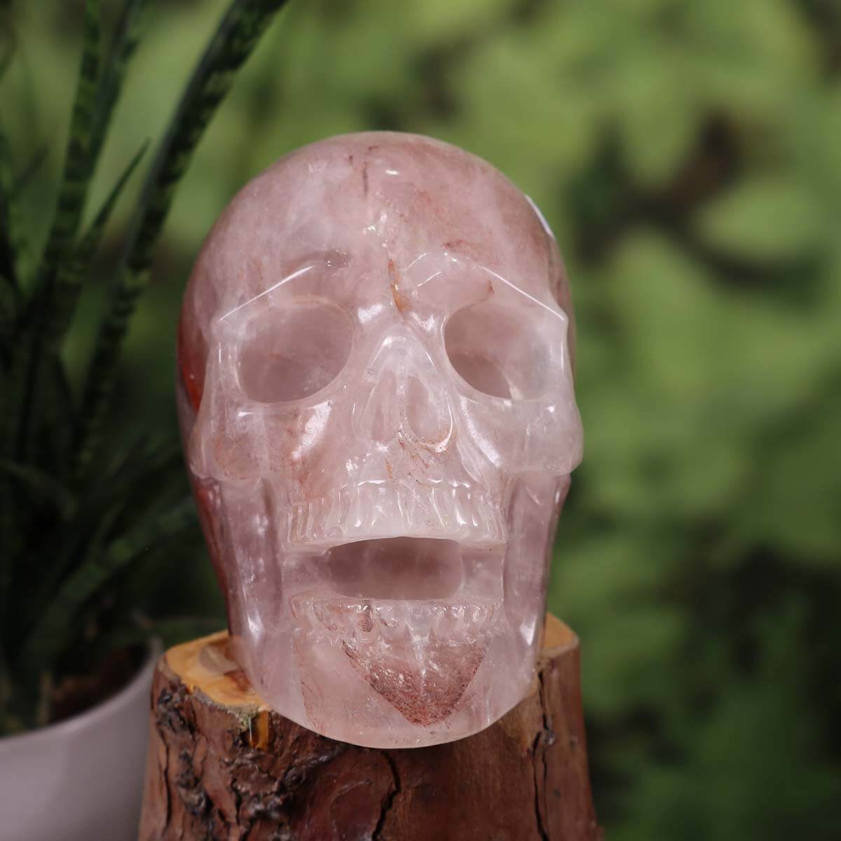 Handcrafted hematite quartz crystal skull, collectors' gemstone with unique shape, ideal for mineral and gemstone enthusiasts.