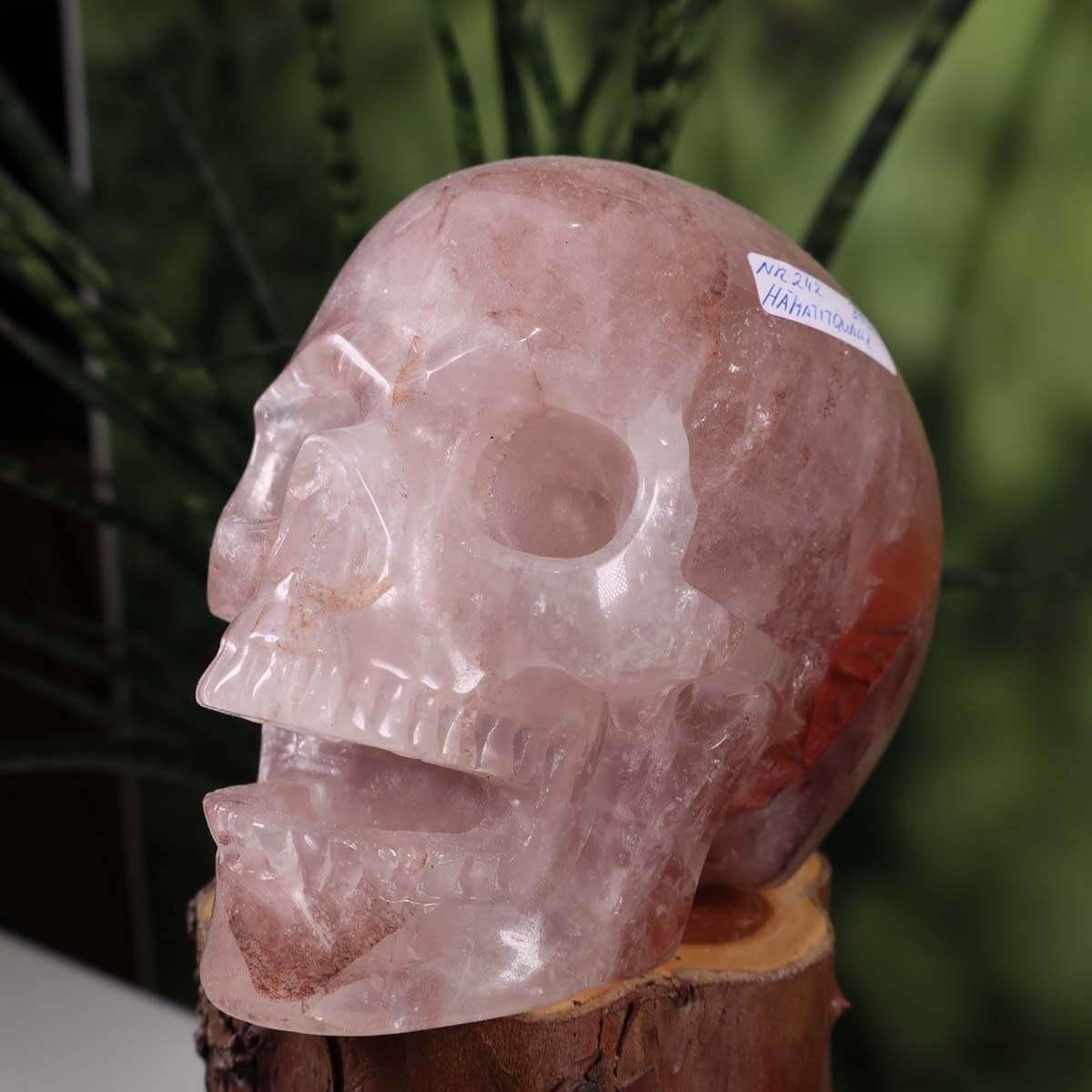 Handcrafted hematite quartz crystal skull, collectors' gemstone with unique shape, ideal for mineral and gemstone enthusiasts.