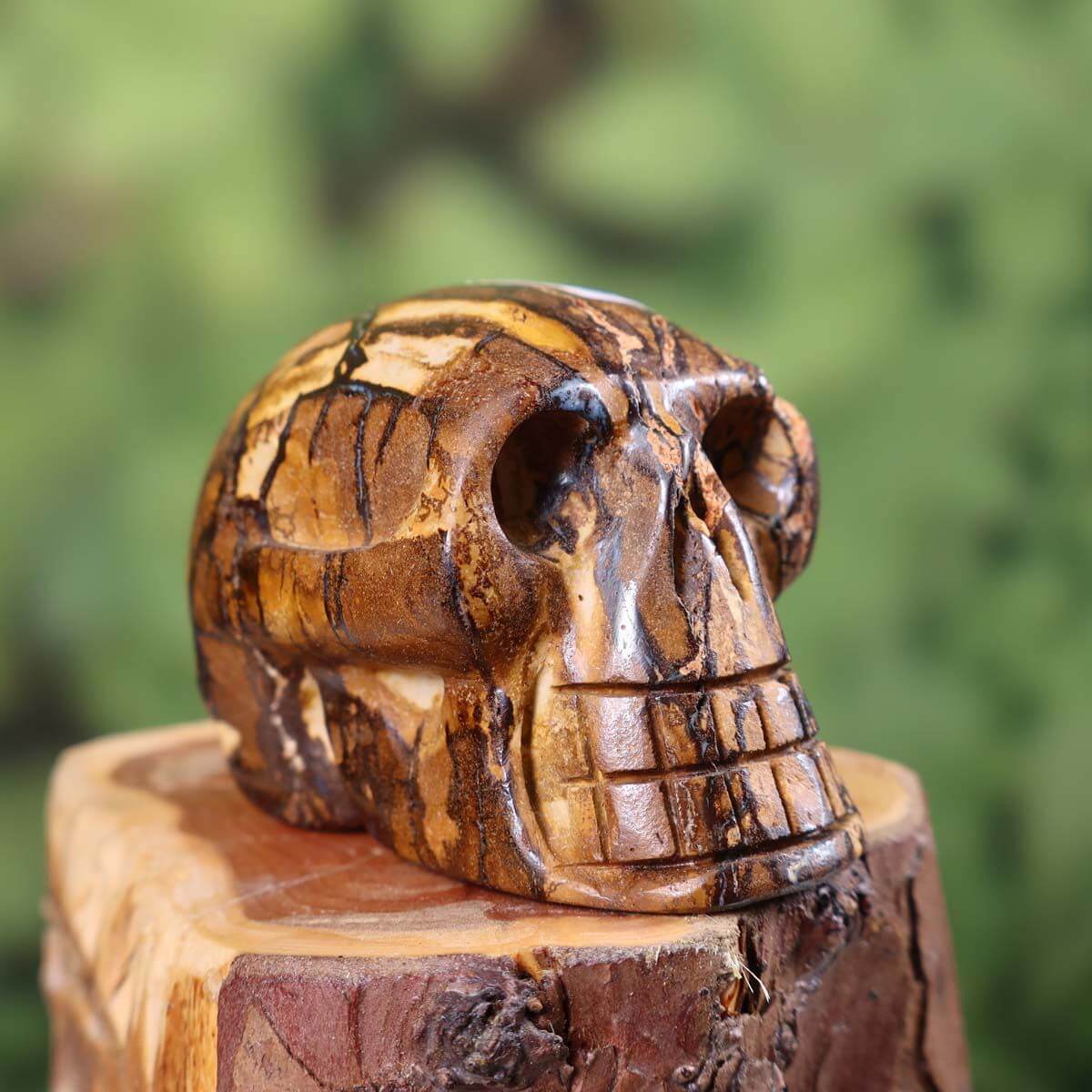 Handcrafted Boulder Opal Crystal Skull, 7x4 cm, unique gemstone sculpture available online at Steinwelten. Buy now.