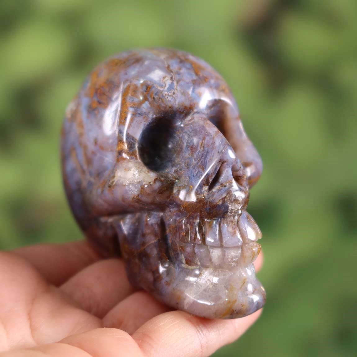 Handcrafted Pietersite crystal skull on display - unique collector's piece by Steinwelten Graz and Wiener Neustadt.