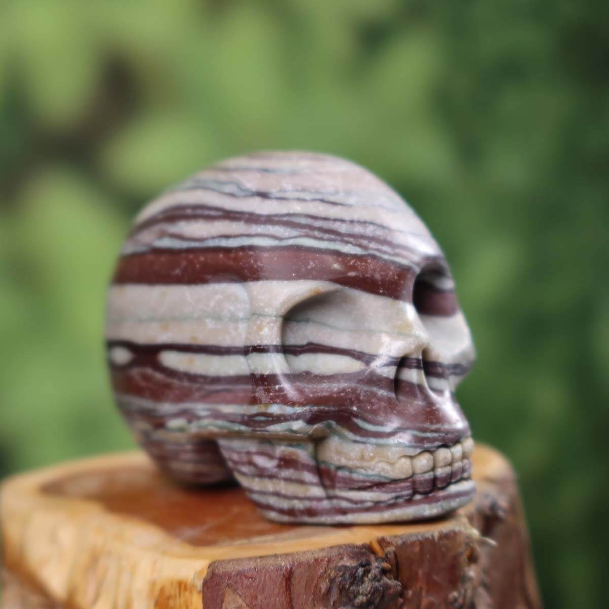 Handcrafted Printstone crystal skull sculpture on display - 7x6 cm