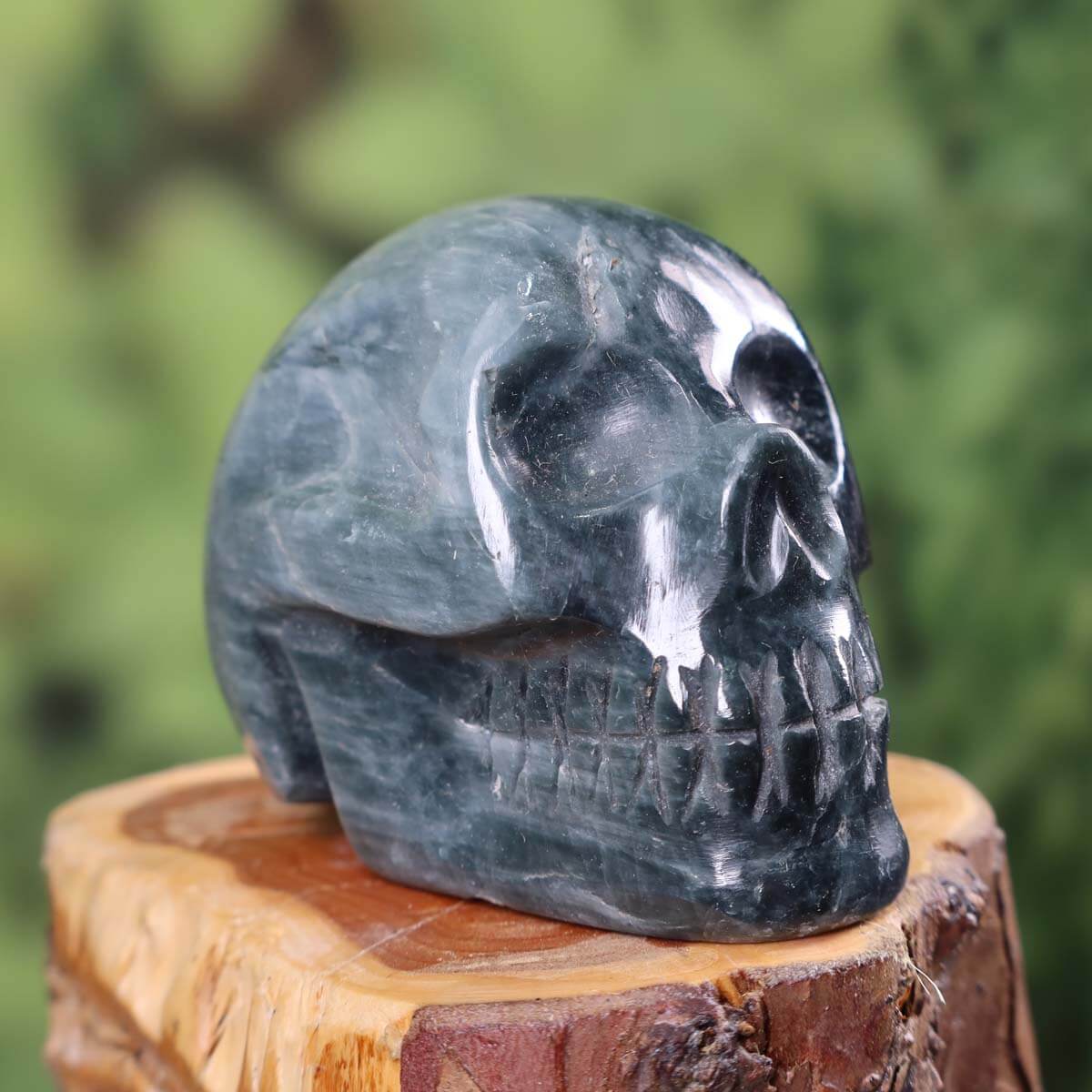 Handcrafted Quartz Cat's Eye Crystal Skull on display, unique mineral gemstone collector's item, 7x6 cm, extraordinary design #329