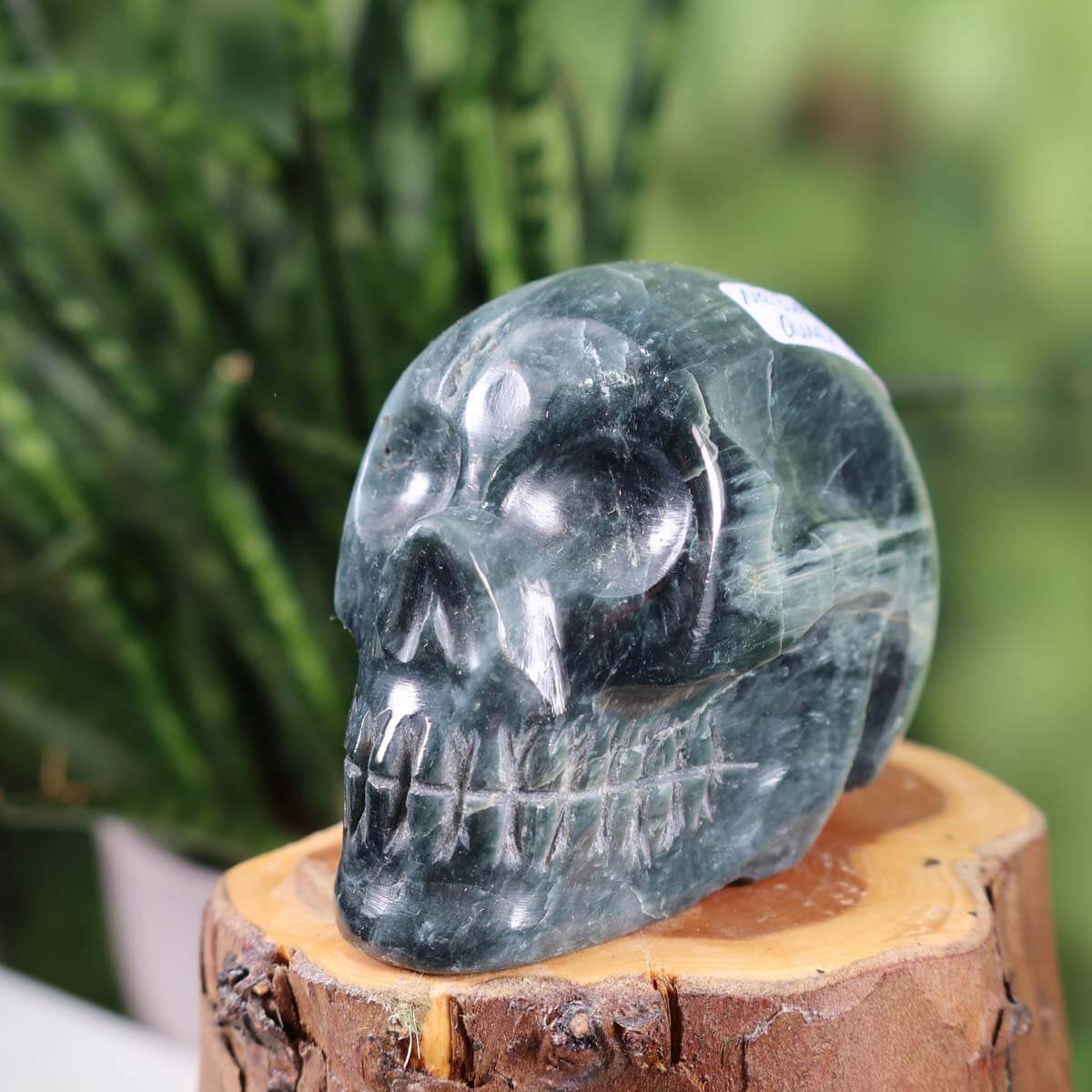 Handcrafted Quartz Cat's Eye Crystal Skull on display, unique mineral gemstone collector's item, 7x6 cm, extraordinary design #329