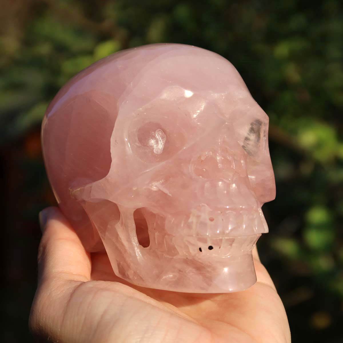Handcrafted rose quartz crystal skull, unique collector's piece in 10x8 cm size, ideal for crystal skull collectors.