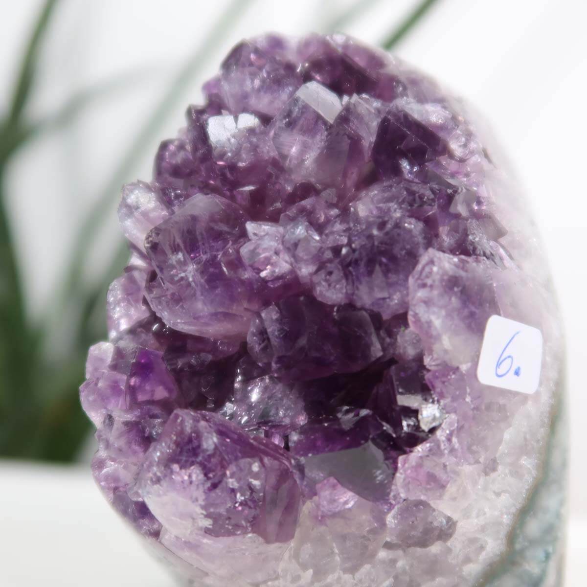 Uruguay Amethyst mini geode with dark purple crystals, measuring 5x8 cm, showcasing natural luster and intense color.
