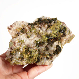 Hand holding Epidot Quartz Crystal Cluster with Clear Crystal Tips, natural mineral specimen from Morocco, ideal for collectors.