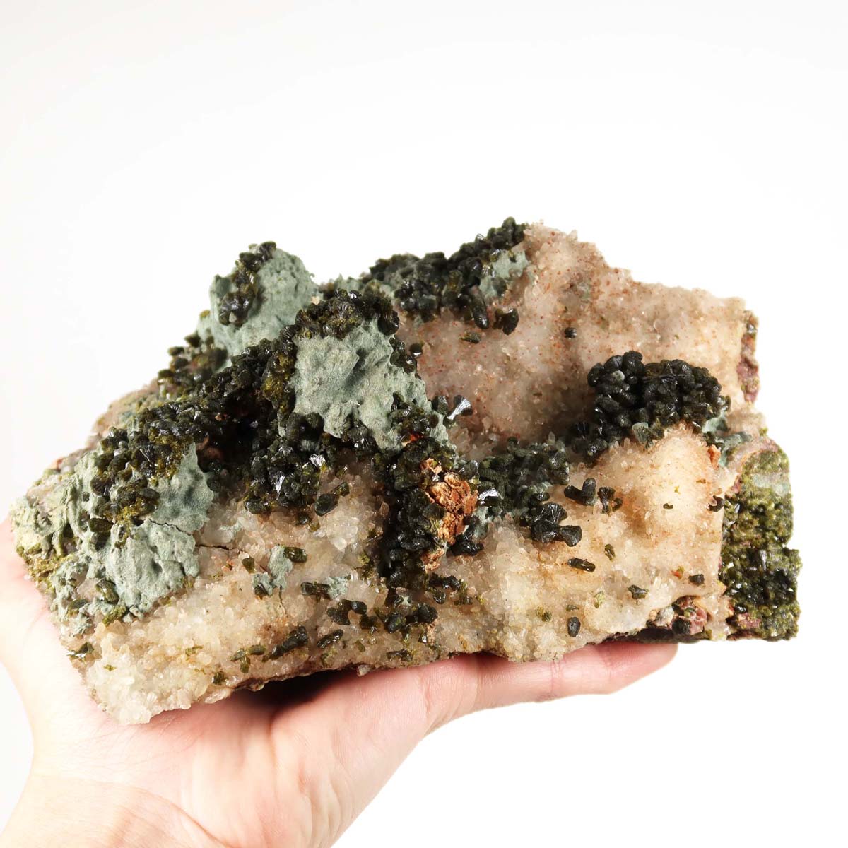 Epdiot quartz crystal with clear quartz points, 17x11x6 cm, held in hand, showcasing natural mineral beauty from Morocco for collectors.