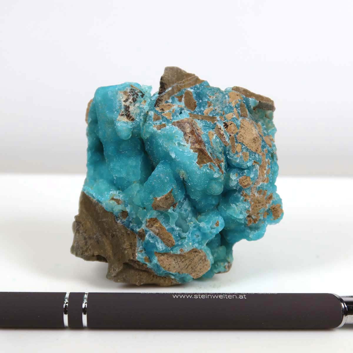 Unpolished Hemimorphite mineral with natural turquoise hues, unique collector's item, 6x8x4 cm, against a plain background.