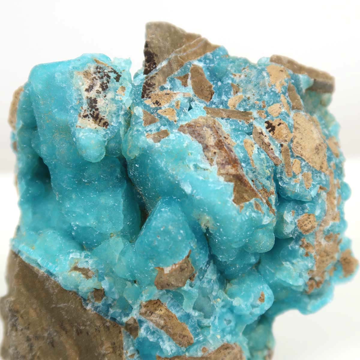 Unpolished Hemimorphite mineral with natural turquoise hues, unique collector's item, 6x8x4 cm, against a plain background.